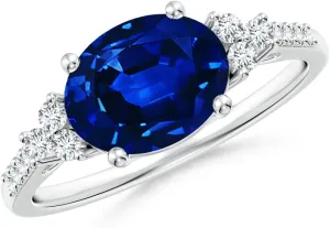 Angara Lab Grown Horizontally Set Oval Sapphire Solitaire Ring with Trio Lab Diamond Accents in Silver / 14K Solid Gold/Platinum | September Birthstone, Birthday, Anniversary Jewelry Gift for Women